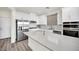 Modern kitchen with white cabinets, stainless steel appliances, and quartz countertops at 244 Native Stone St, Las Vegas, NV 89138