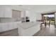 Bright kitchen showcasing the island with white cabinets and dining area at 244 Native Stone St, Las Vegas, NV 89138