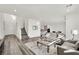 Bright and spacious living room with hardwood floors, modern furniture, and lots of natural light at 244 Native Stone St, Las Vegas, NV 89138