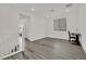 Loft space with wood-look flooring, a desk, and a window with a view at 244 Native Stone St, Las Vegas, NV 89138