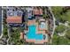 A beautiful community pool with a separate area, lounge seating, and lush landscaping at 244 Native Stone St, Las Vegas, NV 89138