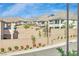 Beautiful shot of homes showcasing modern exteriors and desert landscaping against a mountain backdrop at 244 Native Stone St, Las Vegas, NV 89138