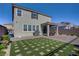 Beautiful backyard features patio, artificial turf, stainless grill, desert landscaping and a view fence at 2581 Tolmezzo St, Henderson, NV 89044