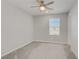 Bedroom featuring carpet floors, a ceiling fan, and a window with natural light at 2581 Tolmezzo St, Henderson, NV 89044