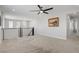 Bonus room with carpet, ceiling fan, and view of the neighborhood at 2581 Tolmezzo St, Henderson, NV 89044