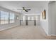 Upstairs bonus room featuring carpet flooring, neutral paint, and a ceiling fan at 2581 Tolmezzo St, Henderson, NV 89044
