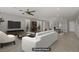 Open living space with stylish decor, complemented by a ceiling fan and ample natural light at 2581 Tolmezzo St, Henderson, NV 89044