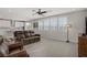 Inviting living room with plush seating, large windows, and a seamless connection to the kitchen at 2581 Tolmezzo St, Henderson, NV 89044