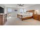 Spacious main bedroom with carpet flooring, large windows, ceiling fan, and beautiful furnishings at 2581 Tolmezzo St, Henderson, NV 89044