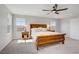 Main bedroom with carpet flooring, ceiling fan, natural light, and nice furnishings at 2581 Tolmezzo St, Henderson, NV 89044