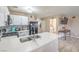 Spacious kitchen with a large island, white cabinets, and stainless steel sink at 2620 Sierra Seco Ave # 101, Las Vegas, NV 89106