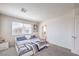 Bright bedroom features plush carpet, neutral walls, and serene decor, creating a tranquil retreat at 2657 Fawn Beige Ct, North Las Vegas, NV 89086