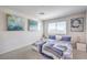 Bright bedroom features plush carpet, neutral walls, and serene decor, creating a tranquil retreat at 2657 Fawn Beige Ct, North Las Vegas, NV 89086