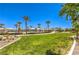 Lush community green space featuring walking paths and ample space for relaxation on a beautiful sunny day at 2657 Fawn Beige Ct, North Las Vegas, NV 89086