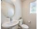 Convenient powder room with pedestal sink and modern fixtures at 2657 Fawn Beige Ct, North Las Vegas, NV 89086