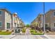Beautiful street view of townhomes featuring well-maintained landscaping and sidewalks at 2657 Fawn Beige Ct, North Las Vegas, NV 89086