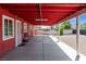 Covered back patio featuring a concrete floor, painted ceiling and supporting columns at 2809 Webster St, North Las Vegas, NV 89030