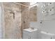A modern bathroom features custom tile work, a shower, and a vanity at 2809 Webster St, North Las Vegas, NV 89030