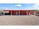 A red single-story home with a large covered patio area at 2809 Webster St, North Las Vegas, NV 89030