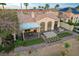 Expansive aerial view of the home's backyard featuring a hot tub, patio, desert landscape and golf course at 2885 Red Springs Dr, Las Vegas, NV 89135