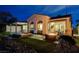 Backyard with hot tub, covered patio, and a modern fire pit create the perfect space for relaxation and entertaining at 2885 Red Springs Dr, Las Vegas, NV 89135