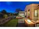 Backyard with hot tub, fire pit, and professional lighting creates a relaxing evening retreat at 2885 Red Springs Dr, Las Vegas, NV 89135
