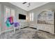 Bright bedroom with modern fan, shuttered windows, and stylish decor on shelving unit at 2885 Red Springs Dr, Las Vegas, NV 89135
