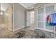 Open doorway into a bedroom with an accent rug and gray wood look flooring at 2885 Red Springs Dr, Las Vegas, NV 89135