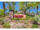 Beautiful Red Rock Country Club signage with well-maintained landscaping in a desert setting at 2885 Red Springs Dr, Las Vegas, NV 89135