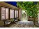 Inviting courtyard featuring elegant seating, a decorative wreath, and a beautiful, mature lemon tree at 2885 Red Springs Dr, Las Vegas, NV 89135