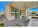 Covered patio with ceiling fan, lounge area, and access to the backyard with golf course views at 2885 Red Springs Dr, Las Vegas, NV 89135