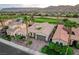 Stunning single-story home with tile roof, desert landscaping, stone driveway, and golf course view at 2885 Red Springs Dr, Las Vegas, NV 89135