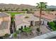 Charming single-story home with a tile roof, lush landscaping, and a private courtyard entrance at 2885 Red Springs Dr, Las Vegas, NV 89135