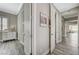 Bright hallway with gray wood flooring, white trim, and easy access to multiple rooms at 2885 Red Springs Dr, Las Vegas, NV 89135
