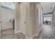 Spacious hallway with shuttered window, gray walls, and easy access to laundry room at 2885 Red Springs Dr, Las Vegas, NV 89135
