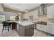 Well-appointed kitchen with stainless steel appliances, gas range, bar seating, and modern pendant lights at 2885 Red Springs Dr, Las Vegas, NV 89135