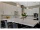 Modern kitchen featuring custom cabinets, quartz countertops, a wine cooler and stainless steel appliances at 2885 Red Springs Dr, Las Vegas, NV 89135
