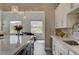 Bright kitchen features pendant lighting, quartz countertops, stainless steel appliances, and a gray backsplash at 2885 Red Springs Dr, Las Vegas, NV 89135