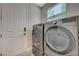 Bright laundry room features stainless steel washer and dryer, plus natural light from a window at 2885 Red Springs Dr, Las Vegas, NV 89135