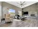 Comfortable living room showcasing sleek floors, mountain views, fireplace, and ample natural light at 2885 Red Springs Dr, Las Vegas, NV 89135