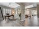 Open concept office featuring wood-look tile flooring, a zebra rug, and a comfortable desk and chair at 2885 Red Springs Dr, Las Vegas, NV 89135