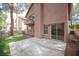 This backyard features artificial grass, stone pavers, block wall and covered patio at 3025 Yankee Clipper Dr, Las Vegas, NV 89117