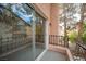 View of the balcony with black metal railing and a sliding glass door at 3025 Yankee Clipper Dr, Las Vegas, NV 89117