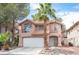 Charming two-story home features a well-manicured yard, two-car garage, and classic southwest architecture at 3025 Yankee Clipper Dr, Las Vegas, NV 89117