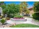 Beautiful community fountain with colorful flowers and lush landscaping at 3025 Yankee Clipper Dr, Las Vegas, NV 89117
