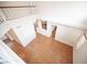 Entryway with wood-look floors, high ceilings, wood railing, and natural light from a window on the right at 3025 Yankee Clipper Dr, Las Vegas, NV 89117