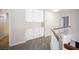 Upstairs hallway features white cabinets and railing, plus gray carpeting and access to multiple rooms at 3025 Yankee Clipper Dr, Las Vegas, NV 89117