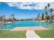 Beautiful lake view with palm trees and mountains in the background at 3025 Yankee Clipper Dr, Las Vegas, NV 89117