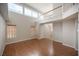 Sun-filled living area features high ceilings, hardwood floors, and staircase to the second level at 3025 Yankee Clipper Dr, Las Vegas, NV 89117