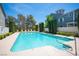 Community swimming pool with lounge chairs and manicured landscaping at 3025 Yankee Clipper Dr, Las Vegas, NV 89117